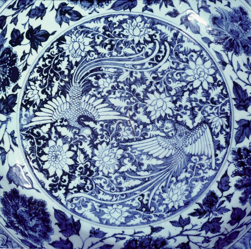 Detail of a blue and white plate with representations of the male and female phoenix