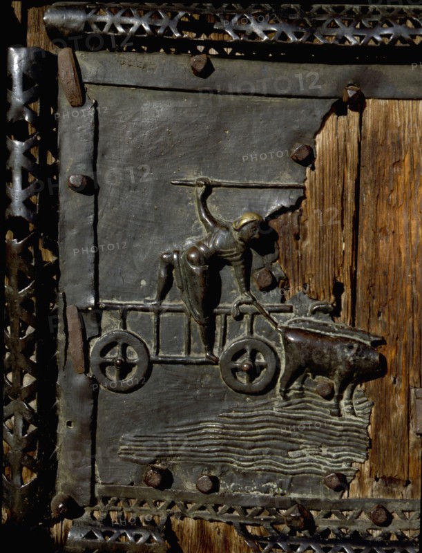 Detail of the bronze door of the Basilica of San Zeno which is decorated with 48 panels illustrating biblical stories and the lives of St Peter, St Paul, St Zeno, St Helena among others, and items connected with music and the three Theological Virtues