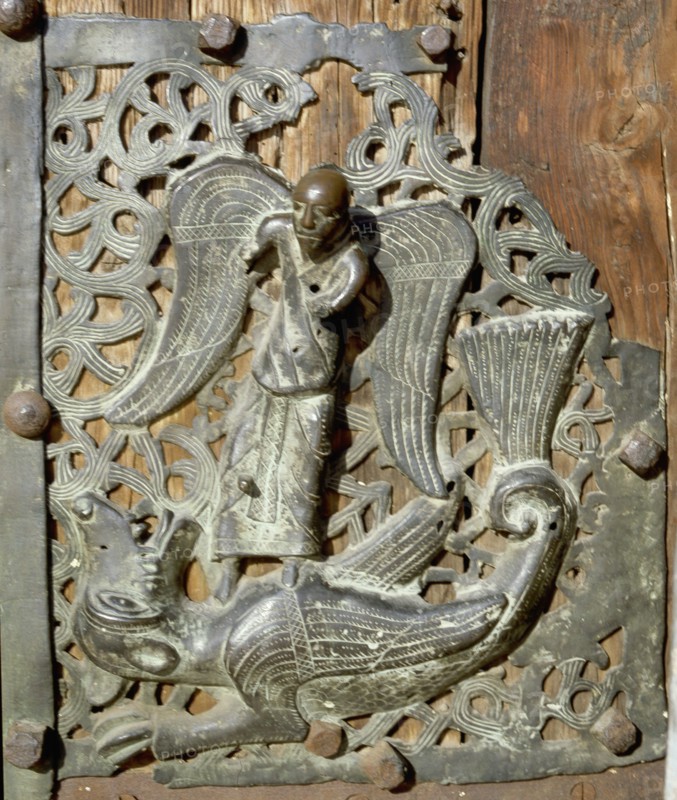 Detail of the bronze door of the Basilica of San Zeno which is decorated with 48 panels illustrating biblical stories and the lives of St Peter, St Paul, St Zeno, St Helena among others, and items connected with music and the three Theological Virtues