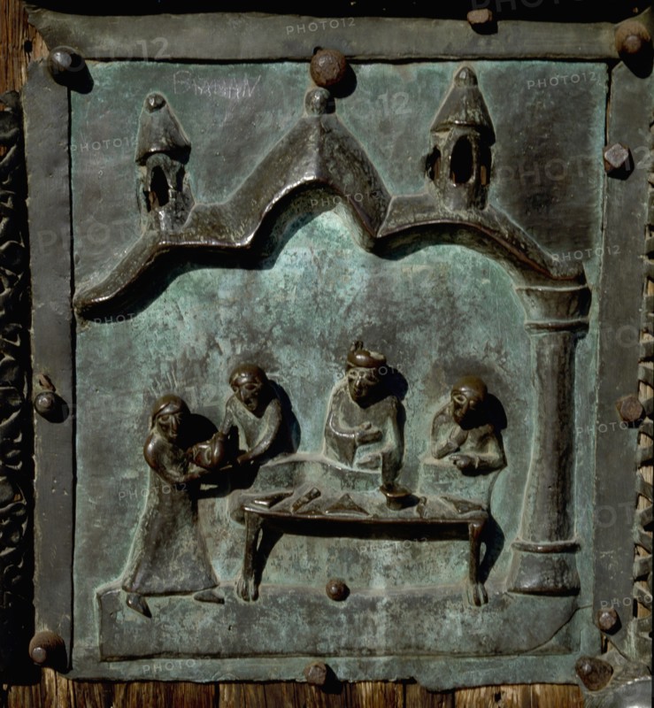 Detail of the bronze door of the Basilica of San Zeno which is decorated with 48 panels illustrating biblical stories and the lives of St Peter, St Paul, St Zeno, St Helena among others, and items connected with music and the three Theological Virtues