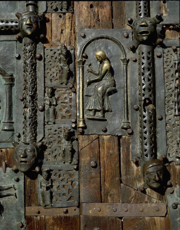 Detail of the bronze door of the Basilica of San Zeno which is decorated with 48 panels illustrating biblical stories and the lives of St Peter, St Paul, St Zeno, St Helena among others, and items connected with music and the three Theological Virtues