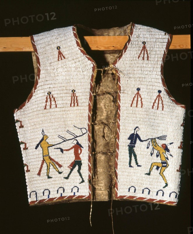 Beadwork decoration on a sleeveless jacket showing fighting between Indians and white men