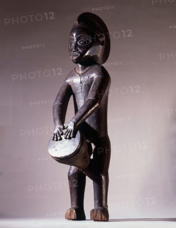 Among the Mbala, wooden sculptures of drummers were kept in the chiefs house as a symbol of his authority