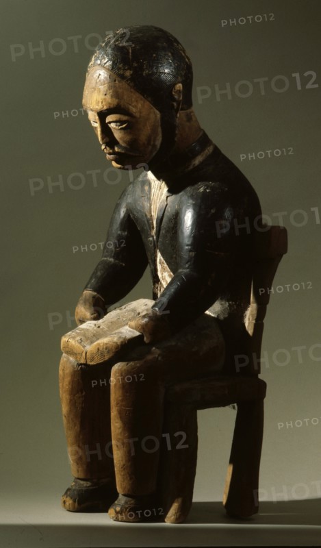 This figure of a man reading a book is believed to depict a Swedish or Swiss missionary