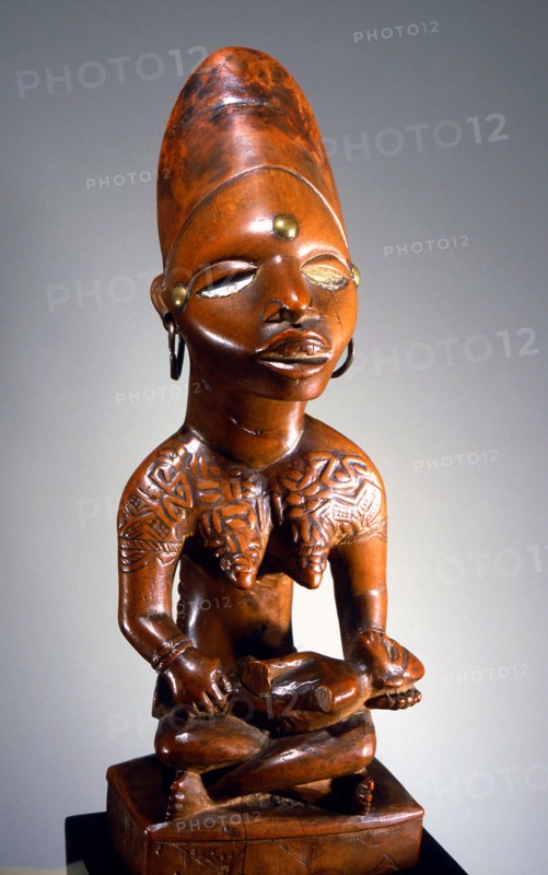Mother and child carving (phemba) honouring female reproductive power, an idealised image of womens role, and by implication of the growth and wealth of the kingdom