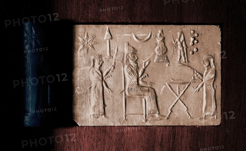 Depiction of seated king holding a drinking bowl and two attendants with fan and fly whisk
