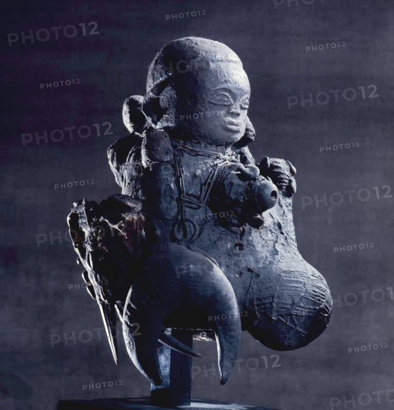 The chains on this Fon bocio, a powerful accumulation of secret objects, symbolize the binding of an enemy