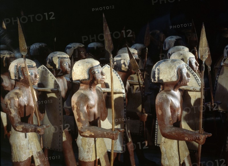 Wooden model of a troop of forty Egyptian soldiers carrying shields and lances