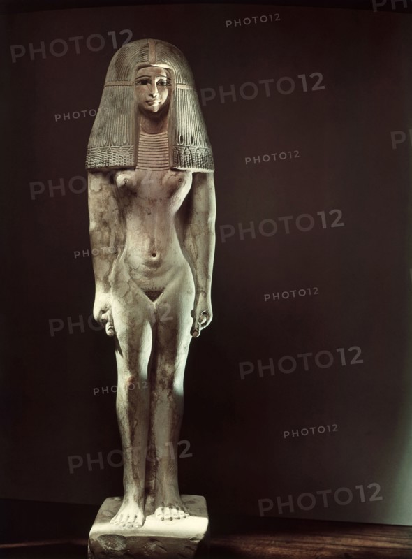 A statuette of a young woman wearing a wig and a broad collar
