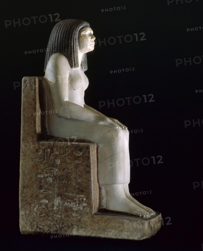 A statue of a seated woman, the royal acquaintance Nynefert min, the wife of an official