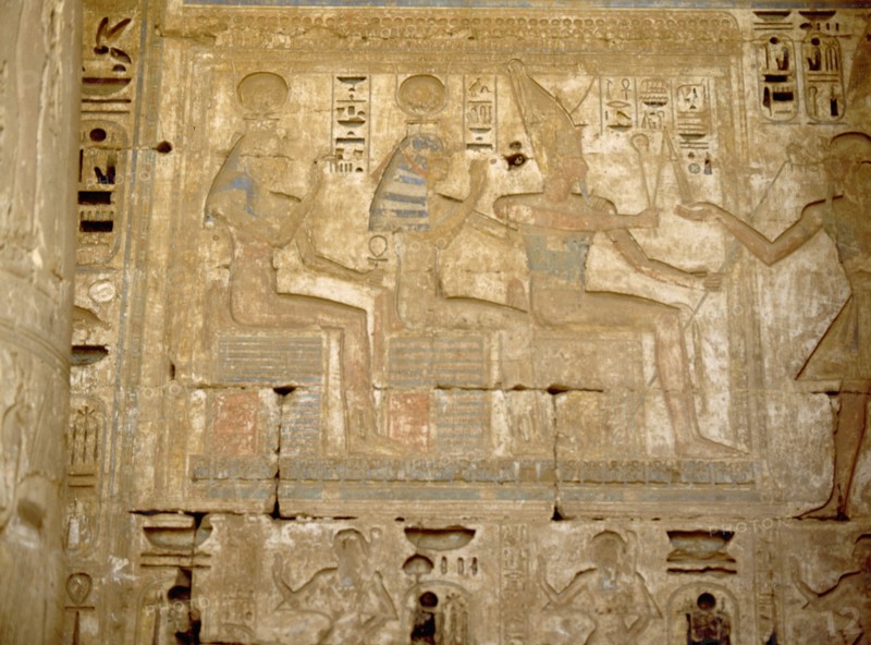 The pharaoh Ramesses III offering to the god Osiris and the goddesses Isis and Hathor