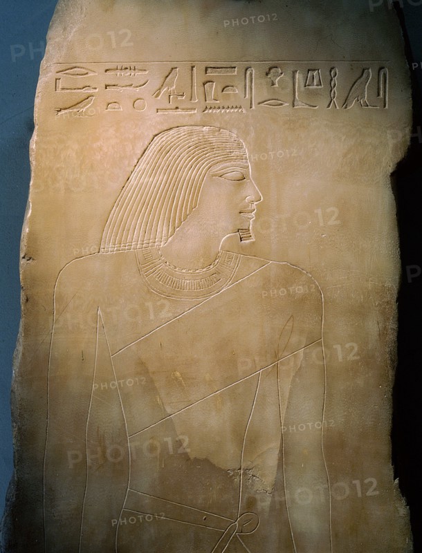An alabaster panel decorated in sunk relief with a profile head and torso of Rawer