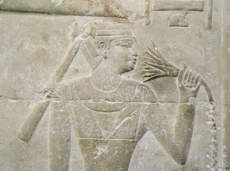 A relief in the tomb of Mereruka depicting a person sniffing a lotus blossom