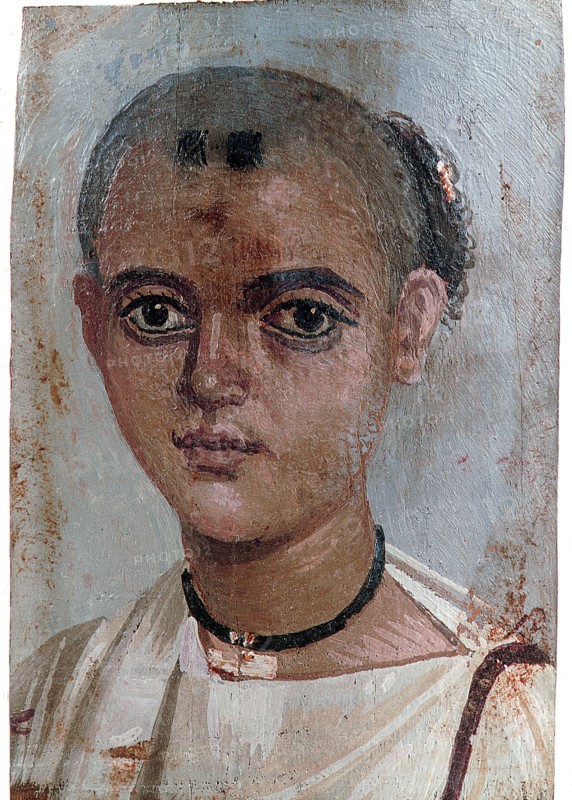 Portrait of a boy wearing gold amulet