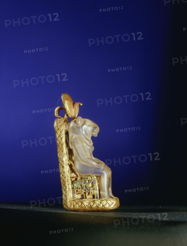 Quartz amulet of the lion headed goddess Bastet seated on a gold throne