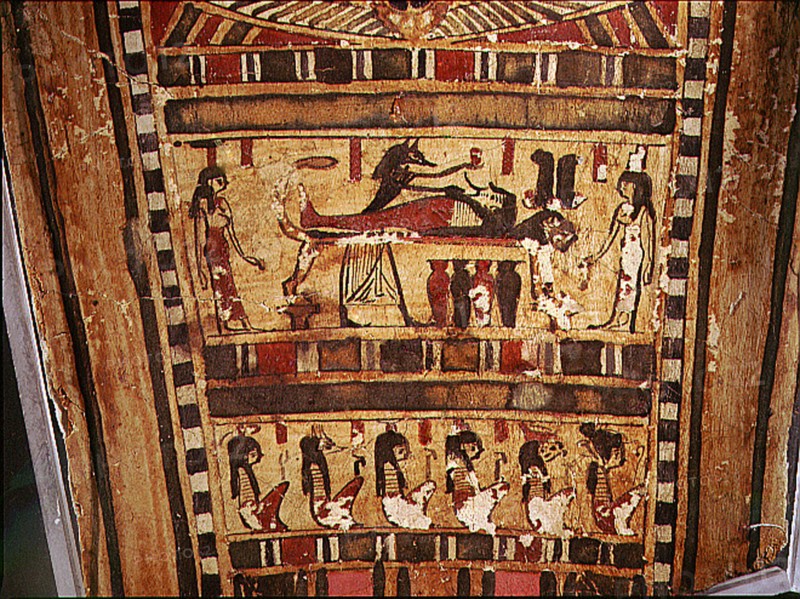 Detail of painted scarcophagus lid, showing the jackel headed Anubis attending the mummified corpse of the deceased