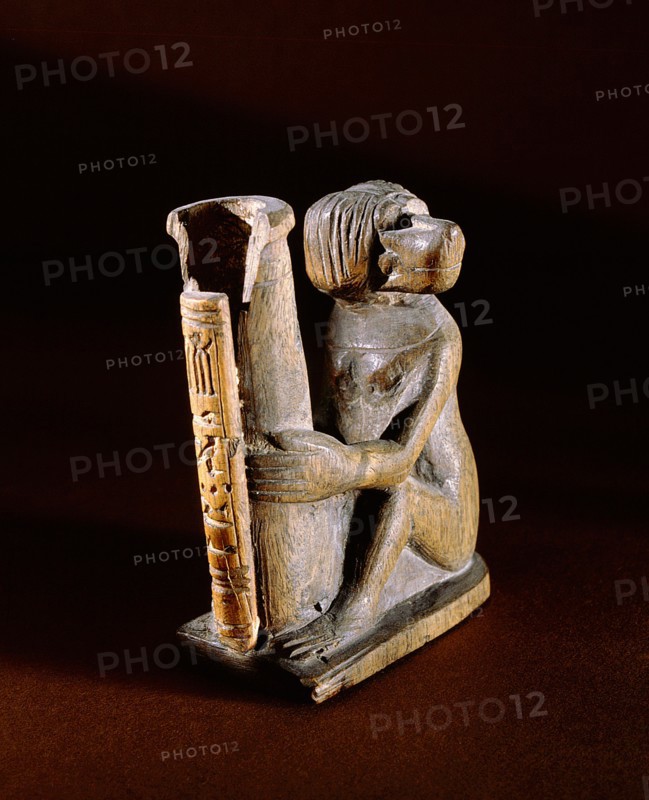 Container for kohl in the form of a cylindrical pot held by a seated monkey