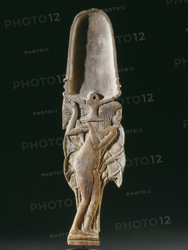 Cosmetic spoon in the form of a young woman in a papyrus thicket supporting a vessel heaped with unguent