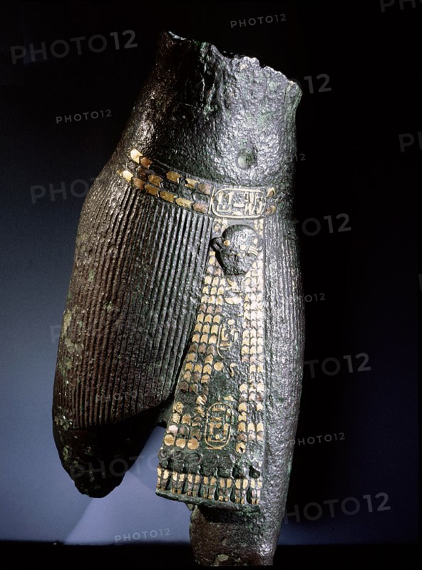 Bronze torso with belt and pleated garment decorated with copper and gold