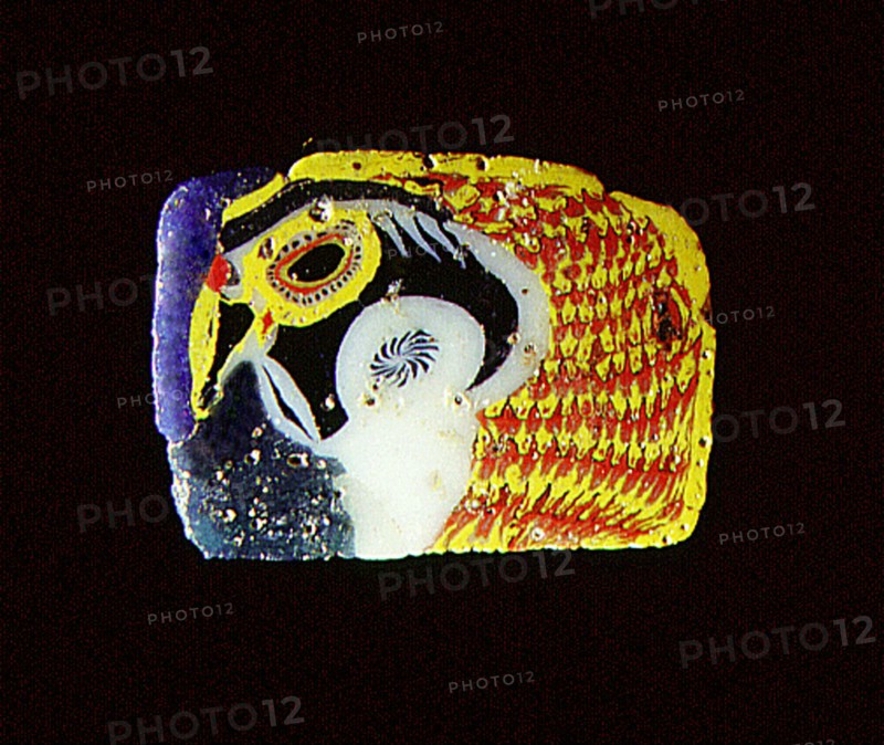 Glass fragment with falcon head