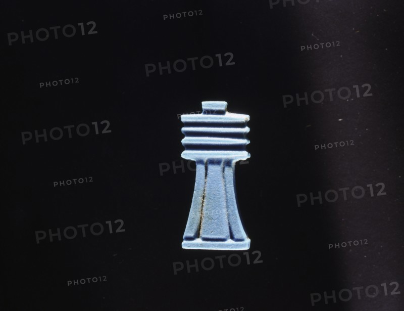 Blue glass furniture inlay depicting a djed(stability)pillar which by the New Kingdom was regarded as a symbol of Osiris