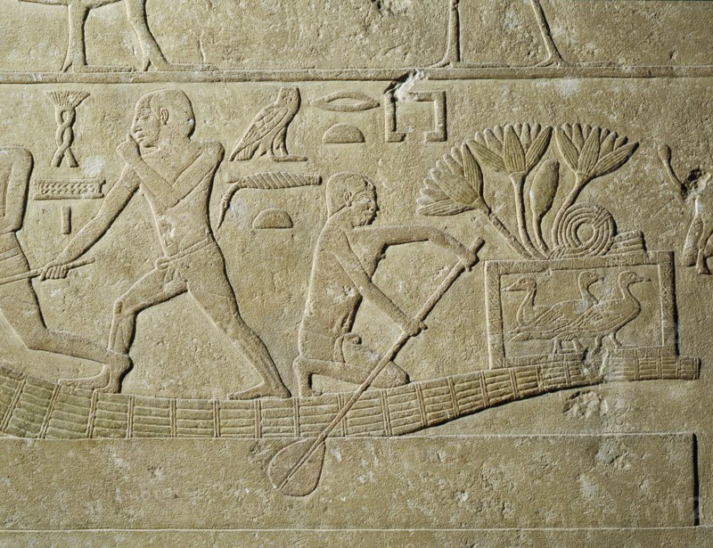 A relief depicting hunters in papyrus reed boats with captured birds in baskets