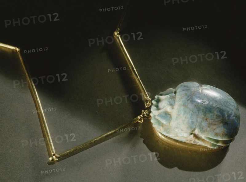 Heart scarab pendant, inscribed on reverse with chapter 26 of the Book of the Dead, from the tomb of General Wen Djeba En Djed, senior official of Psusennes I