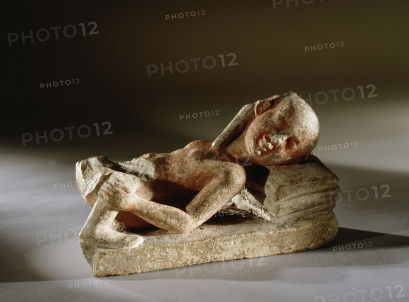 A reclining prostitute with one leg of her client remaining