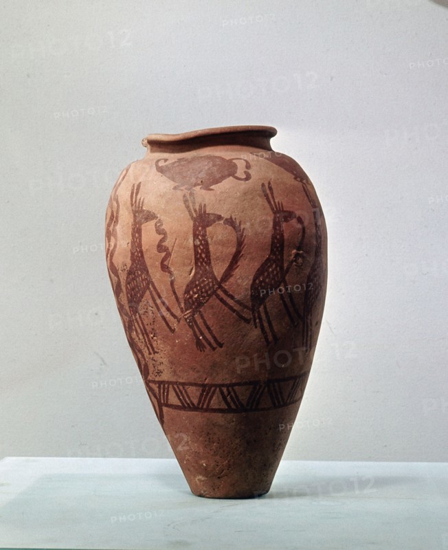 An urn decorated with a design of stylised giraffes