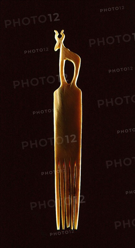 Bone comb crowned with a stylised representation of a gazelle or a similar horned animal