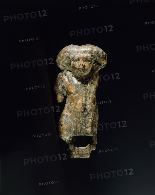 Small ivory statuette in the form of a female dwarf with a massive wig