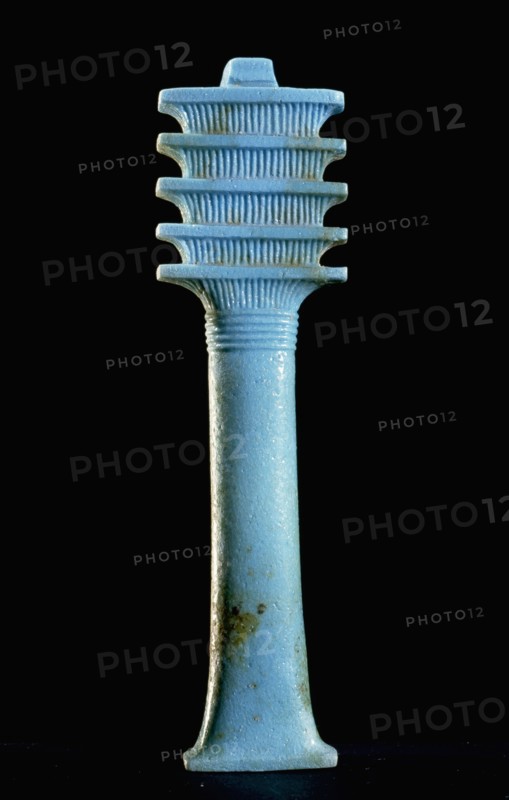 Blue glass furniture inlay depicting a djed (stability) pillar which by the New Kingdom was regarded as a symbol of Osiris