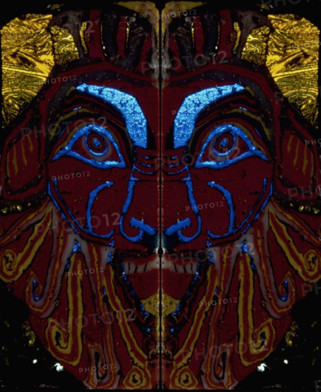 Glass fragments, two half faces of Bes