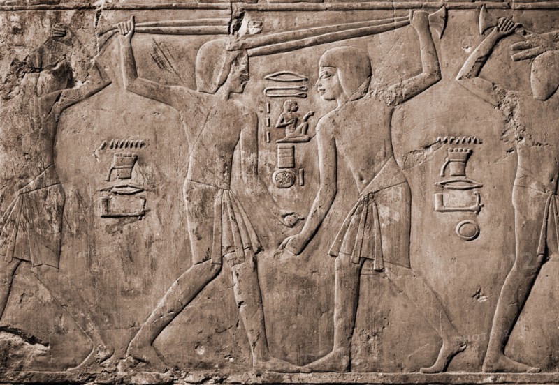 Relief from the tomb of Kharuef of young men in light tunics stick fighting