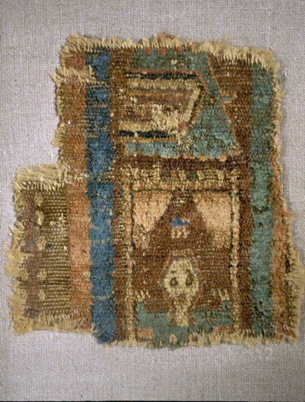 Fragment of a Coptic carpet depicting a person praying in a small room