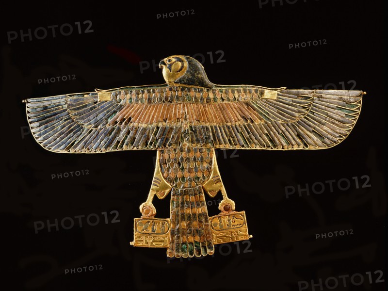 Inlaid gold pectoral in the form of a falcon with outstretched wings, from the tomb of Amenemope