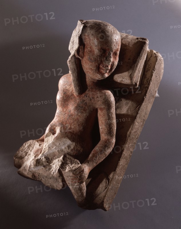 A reclining prostitute with one leg of her client remaining