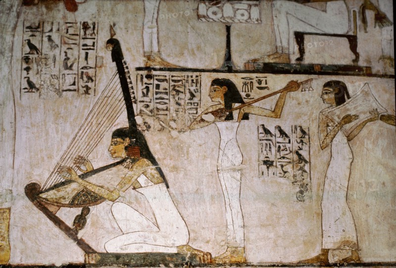 A detail of a wall painting in the tomb of Rekhmire showing women playing the harp, lute and tambourine