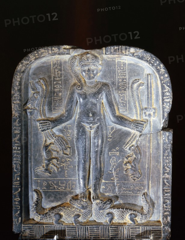 Stele with relief sculpture of Horus with the side lock of hair of youth, standing on two crocodiles