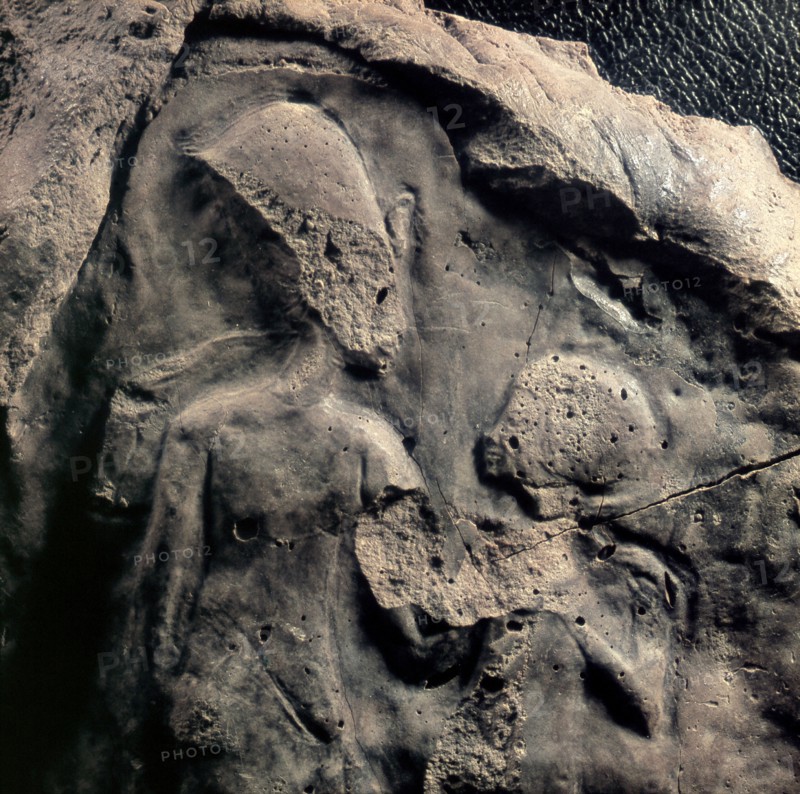 A unfinished relief fragment with the figures of Akhenaten and a child