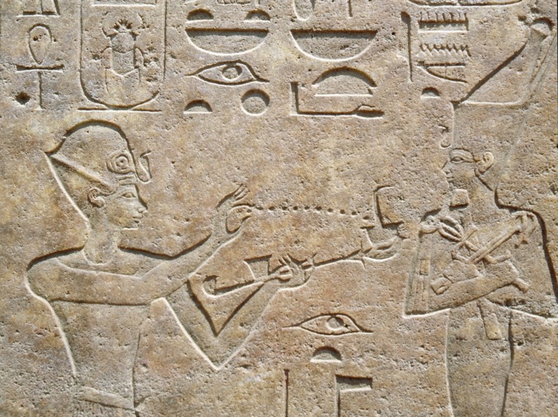 Detail of a relief showing Queen Hatshepsut burning incense to honour a god