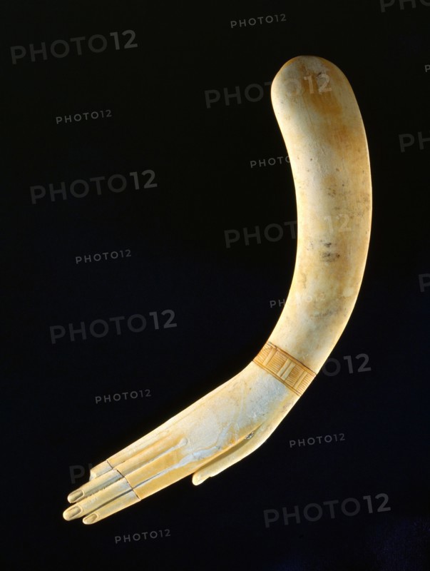 Ivory clapper in the form of a hand