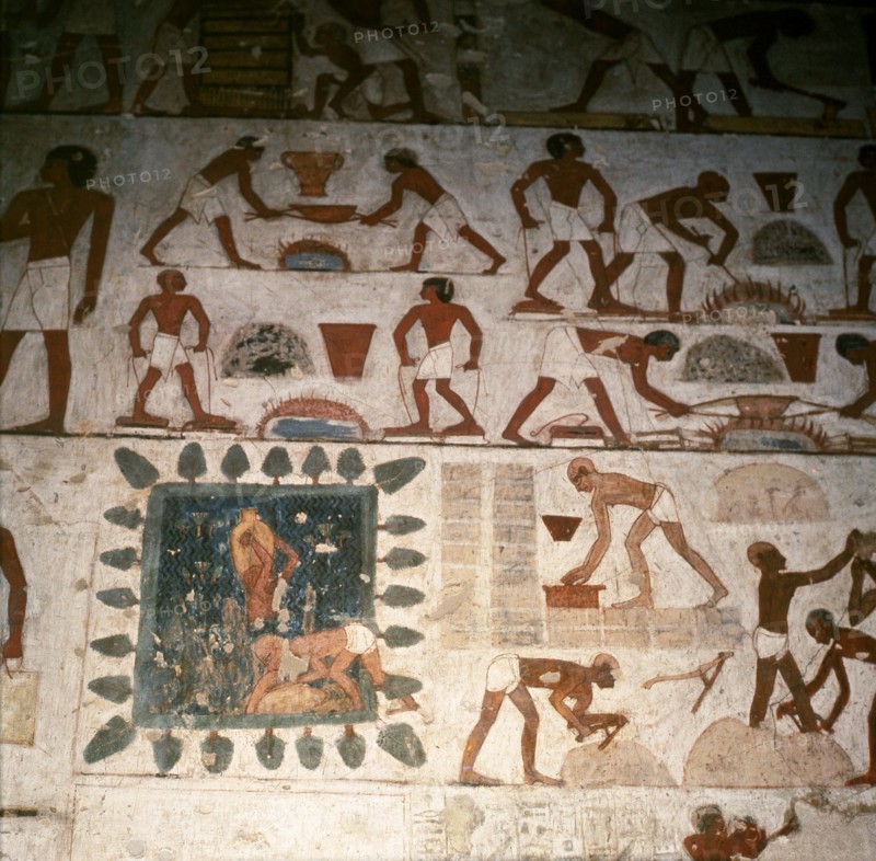 A detail of a wall painting in the tomb of Rekhmire showing a team of workmen making mud bricks