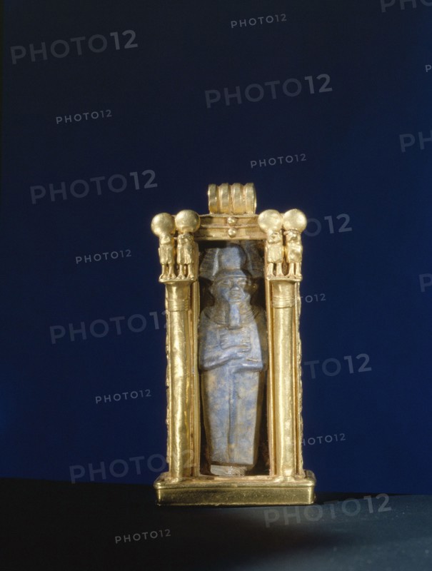 Damaged lapis lazuli amulet of the god Ptah, re used within a gold shrine, from the tomb of Wen Djeba En Djed, senior official of Psusennes I