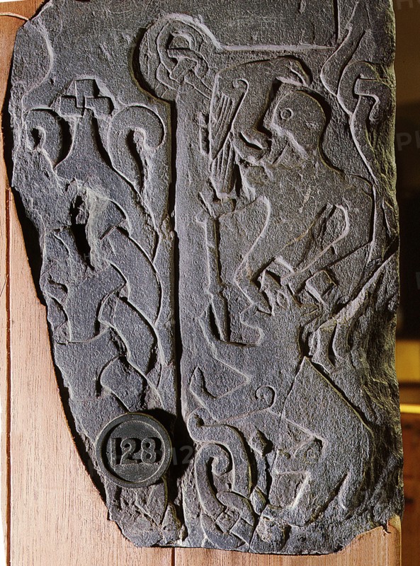 The Andreas Stone with a relief depicting a scene from the legendary Norse poem Ragnarok, Doomsday of the Gods, in which the god Odin is eaten by the wolf Fenrir