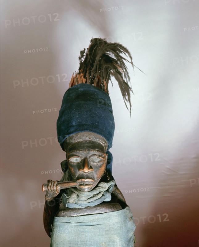 Figures such as this, with a mirror and bundle of medicines concealed in the cloth wrapper, were charged with power by a doctor (nganga) and used to protect, to promote wealth, or to attack enemies