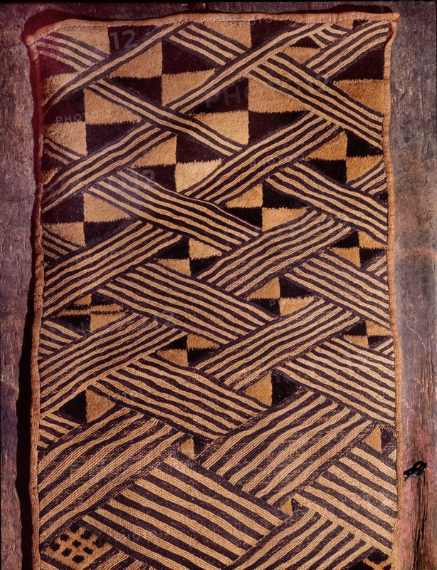These raffia dance skirts were woven in pieces by men using upright single heddle looms, then sewn together and embroidered using a cut pile technique by women