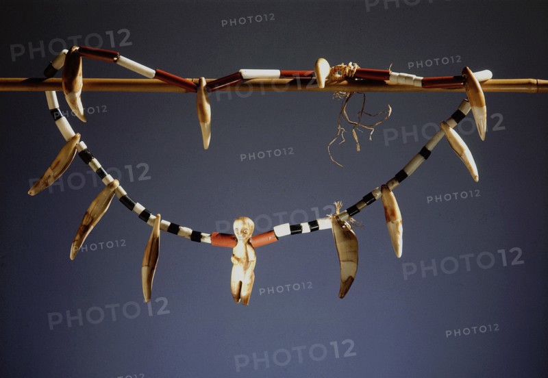 Hunters necklace made from ivory pendants, jaguar teeth and glass beads