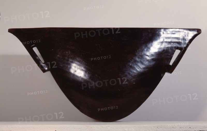 Mangbetu slit drum of mud blackened wood