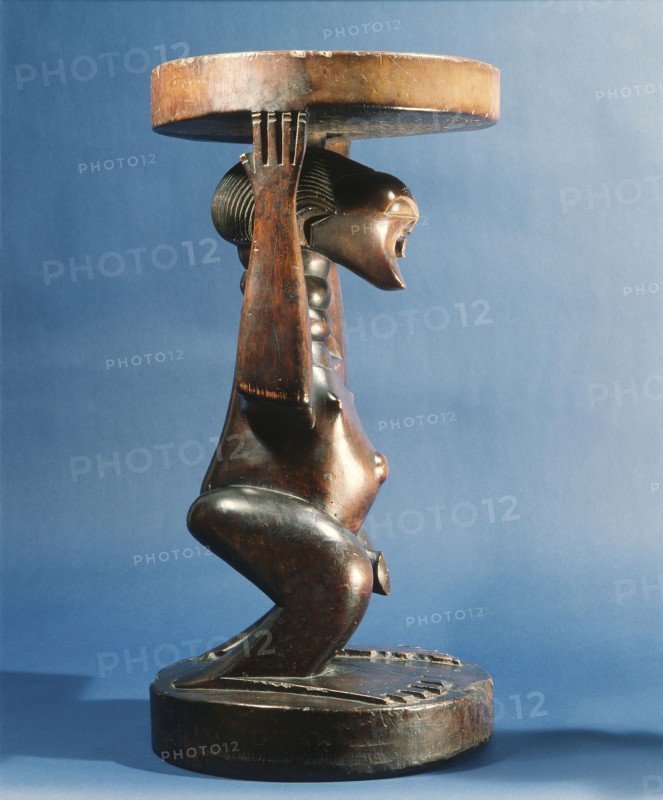 Stool supported by a male figure, served as an emblem of status and prestige for Songye chiefs